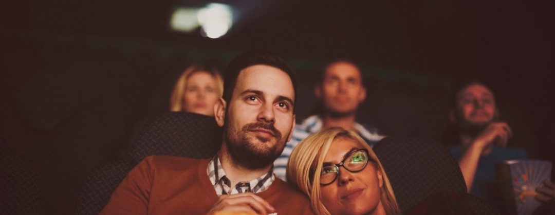 Young Couple At The Cinema Watching Movie Picture